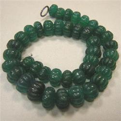 910 CTS CARVED ENHANCED EMERALD STRAND 18-13 MM - 19 INCHES - TEMPORARY CLASP