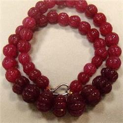460 CTS CARVED GLASS FILLED ENHANCED RUBY STRAND - TEMPORARY CLASP