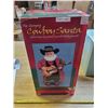 Image 1 : singing cowboy Santa