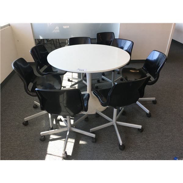 ROUND WHITE SINGLE PEDESTAL TABLE WITH 8 BLACK OFFICE CHAIRS