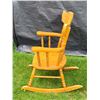 Image 2 : Vintage child's wood rocking chair. Ornate back with spindles.