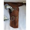Image 2 : Vintage leather holster & cap guns. Missing 1 gun handle plate.