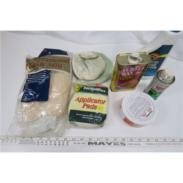 assorted detailing products, wash mitt, applicator pads, trtle wax, chrome polish