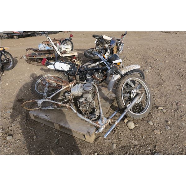 pallet with two motorbike frames, one silver, one black