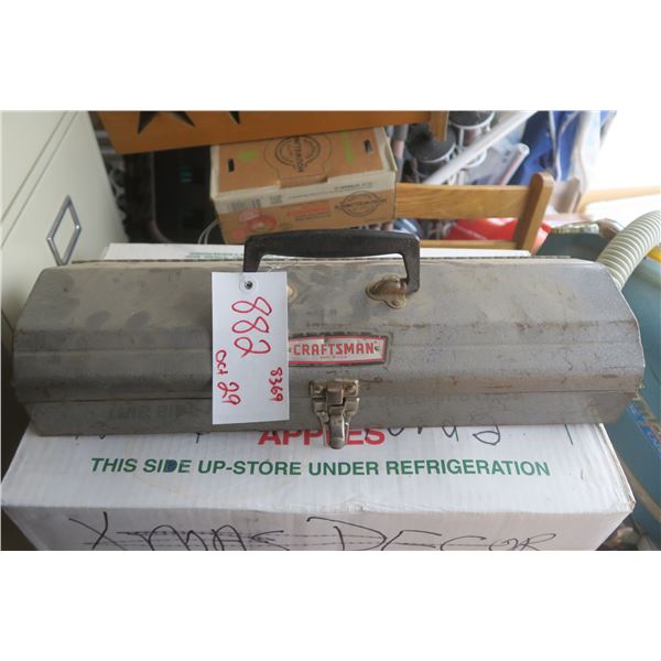 Grey craftsman tool box with a blue greese gun inside