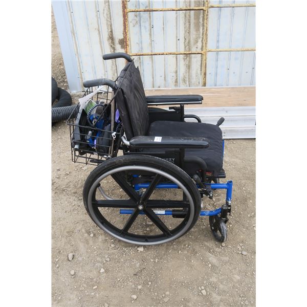 Breezy 600 wheelchair with basket of acc.