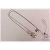 Image 1 : 14kt brushed white gold and yellow gold "sack" style pendant set with three round genuine diamond ge