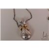 Image 2 : 14kt brushed white gold and yellow gold "sack" style pendant set with three round genuine diamond ge