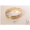 Image 1 : 18kt solid yellow gold bangle 3/4" wide and 7 1/2" in circumference. High polish with hand engraved 