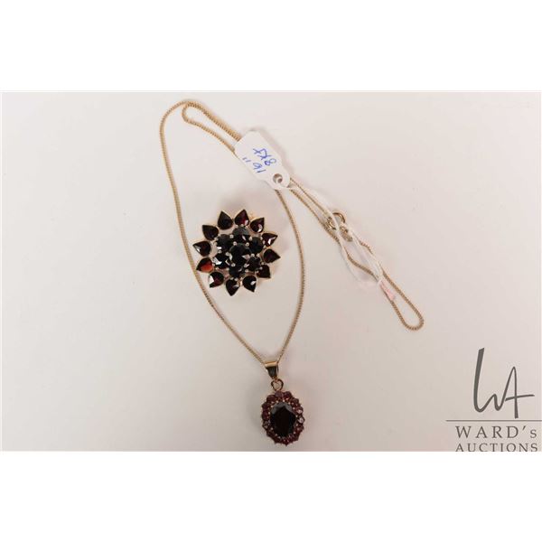 Bohemian garnet cluster pendant and 16" gold neck chain, both marked 333 (8kt) and a Bohemian garnet