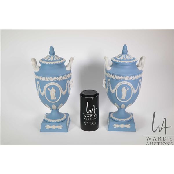 Pair of Wedgwood blue Jasperware lidded urns, each 12" in height