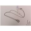 Image 1 : Ladies 10kt white gold and "Infinity" pendant with flickering center diamond gemstone and round whit