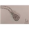 Image 2 : Ladies 10kt white gold and "Infinity" pendant with flickering center diamond gemstone and round whit