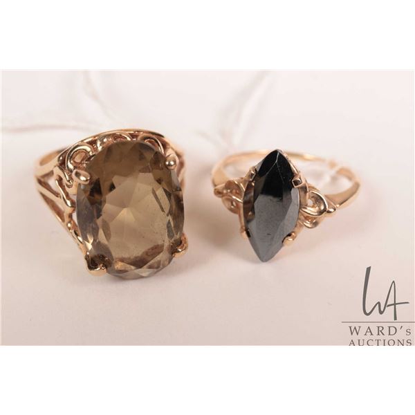 Two 10kt yellow gold rings including diamond shaped hematite ring size 7.5 and oval smoky quartz rin