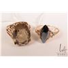 Image 1 : Two 10kt yellow gold rings including diamond shaped hematite ring size 7.5 and oval smoky quartz rin
