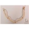 Image 1 : Double strand of graduated pearls with 14kt yellow gold fastener, 7" in length