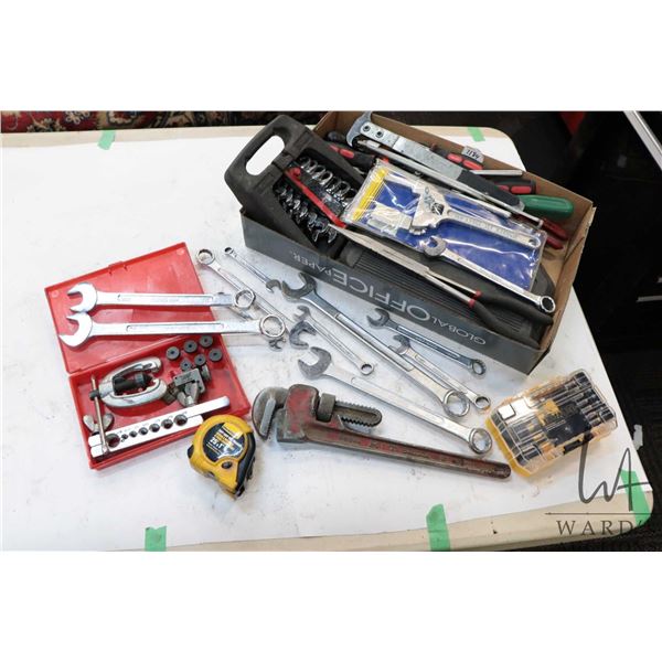 Selection of hand tools including adjustable wrenches, combination wrenches, pipe wrench, ratcheting
