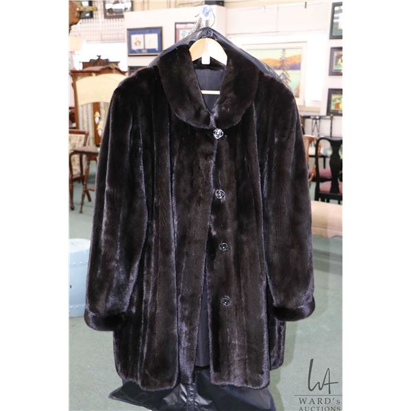 Ladies 3/4 length black mink fur coat with large buttons, purportedly profession stored during off s