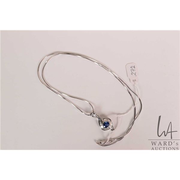 18kt white gold, diamond and blue sapphire gemstone pendant set with oval mixed cut 1.00ct blue sapp