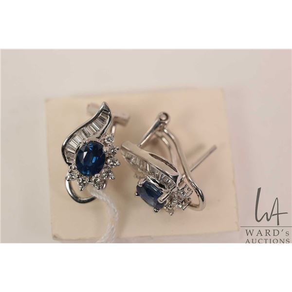 18kt white gold, diamond and sapphire gemstone earrings. Set with two .45ct oval mixed cut sapphire 