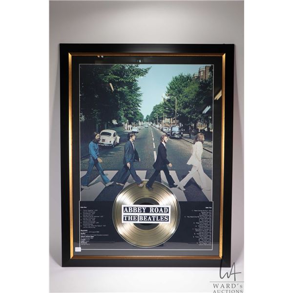 Framed Beatles Abbey Road with gold album and list of songs. Note: Not available for shipping. Local