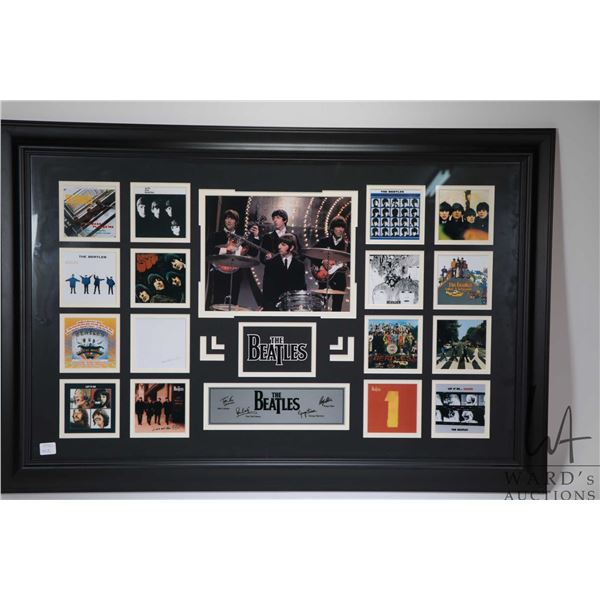 Framed collage of sixteen miniature Beatles album covers . Note: Not available for shipping. Local p