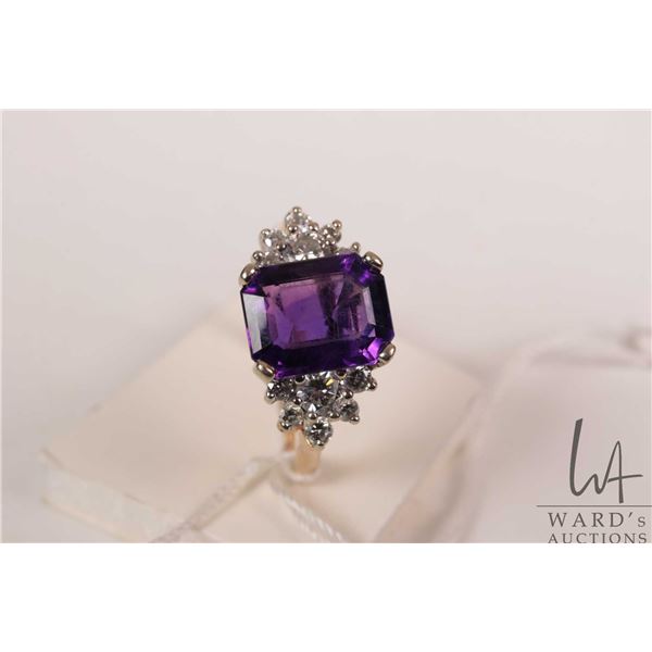 14kt yellow gold and white gold setting, amethyst gemstone and diamond ring. Set with 2.75ct emerald