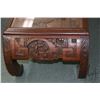 Image 2 : Heavily carved Oriental coffee table with pictorial scenes on top and ends, curved supports, single 