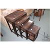 Image 1 : Set of four Oriental nesting tables, each with deep carved pictorial tops and sides, largest table m