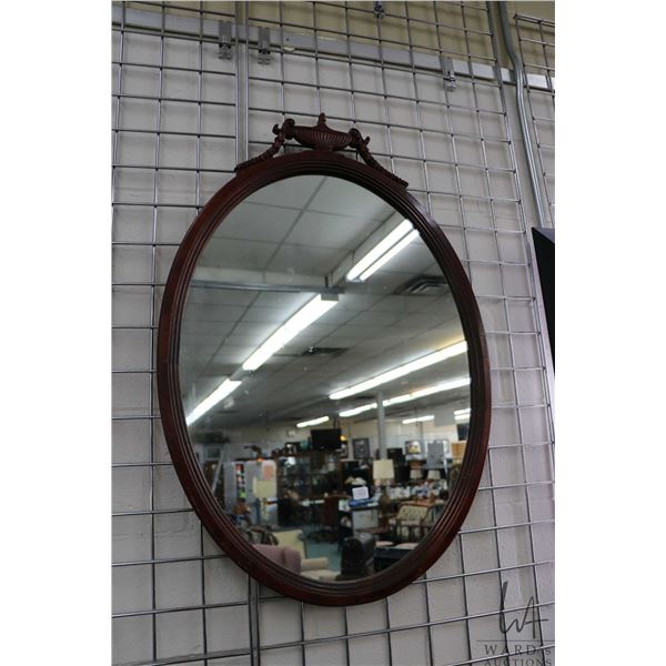 Antique oval framed Regency style wall mirror, overall dimension 36" X 24". Note: Not available for 