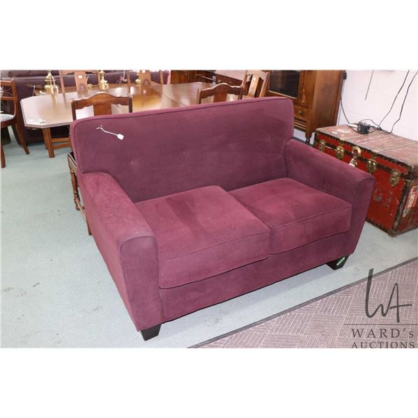 Purple upholstered love seat