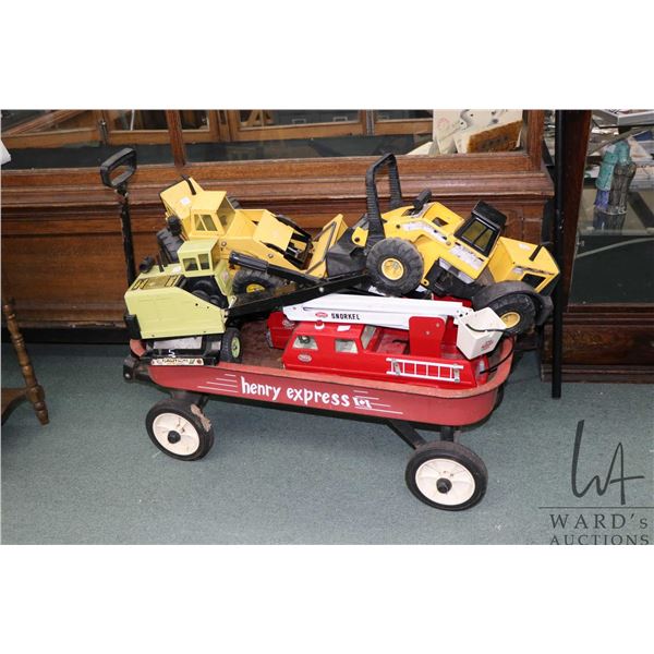 Henry Express red wagon and a five large metal Tonka vehicles including two fire engines, two loader