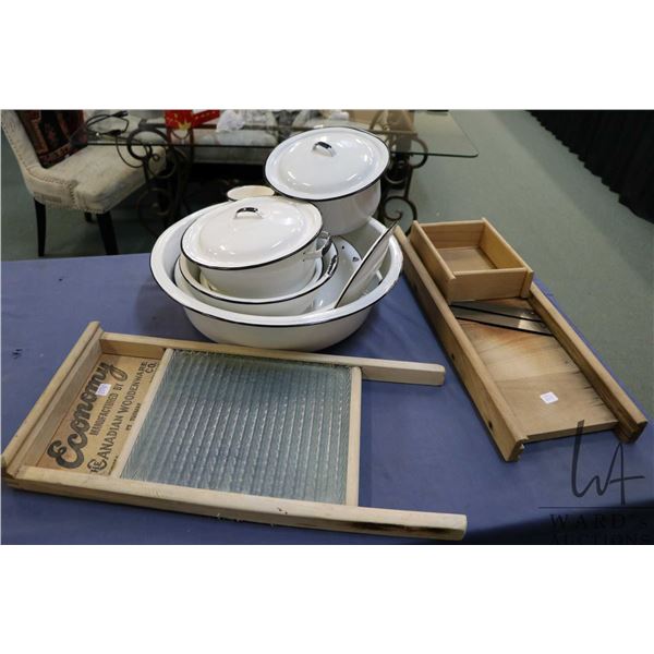 Selection of enamelware including large bowl, two small bowls, three lidded pots, cup etc. plus glas