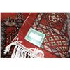 Image 3 : Small square wool area carpet with deep brick background, geometric design, fringed edge and highlig