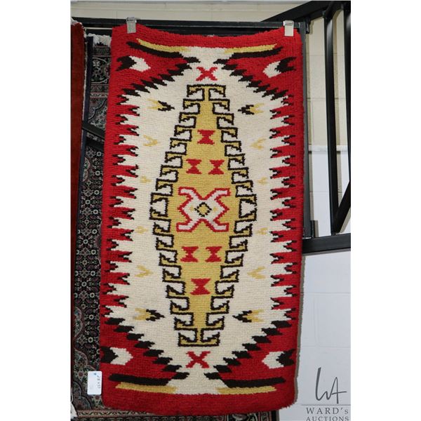 Hooked wool carpet with colourful geometric design including yellow, black and red, 28" X 53"