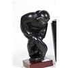 Image 2 : Unsigned carving of an Inuit hunter pulling a seal, on wooden base 6 1/2" in height