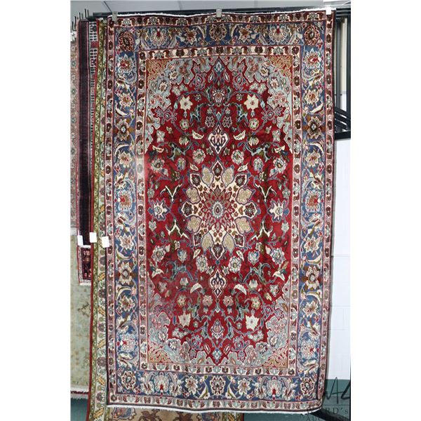 100% handmade Iranian wool "Isfahan" area carpet with center medallion, red background, overall flor