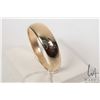 Image 1 : Two 10kt yellow gold wedding band including gent's sized 12.5 and ladies sized 5.75
