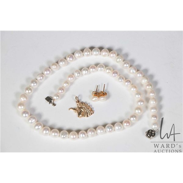 Single strand hand knotted pearl necklace 16" in length plus a pair of freshwater pearl studs and a 