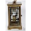 Image 2 : Antique French made carriage clock with Roman numeral dial in brass case with beveled glass panels, 