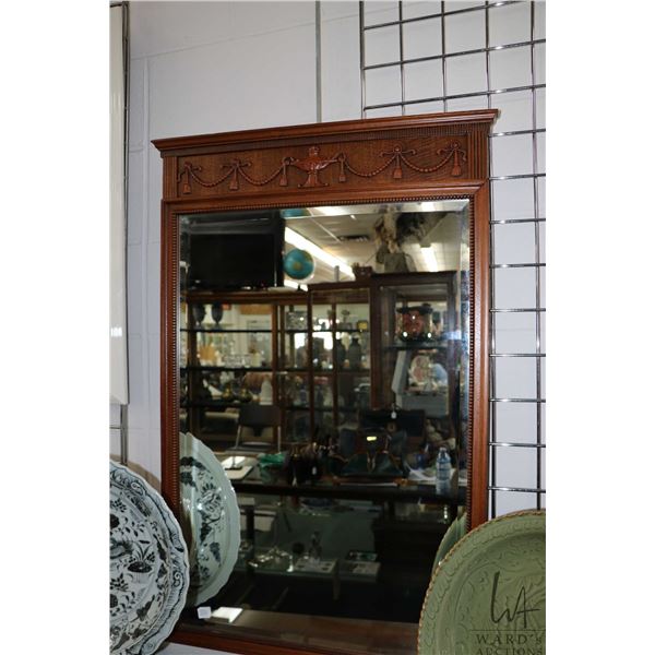 Antique wood framed beveled wall mirror, outside dimensions 38" X 24". Note: Not available for shipp