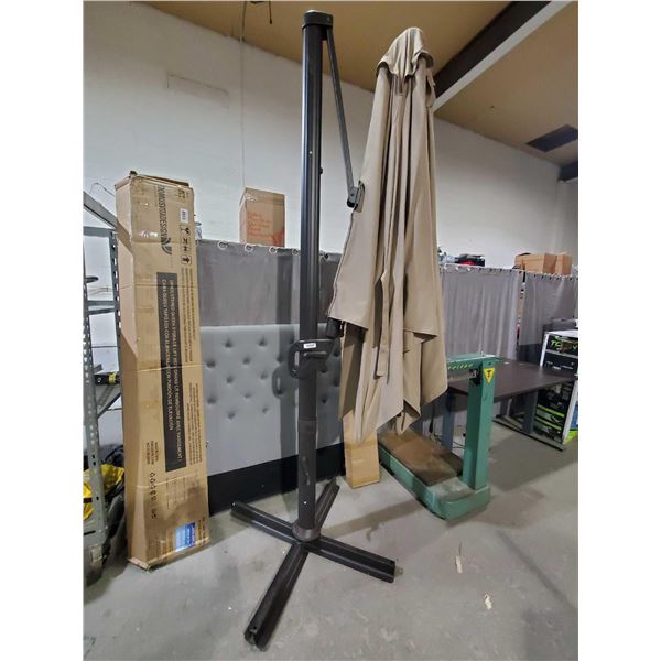 Free Standing Single Post Retractable Patio Umbrella - One tine broken, OUT OF BOX - SOLD AS IS