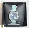 Image 1 : LISE WATIER TURQUOISE FACE WATCH WITH