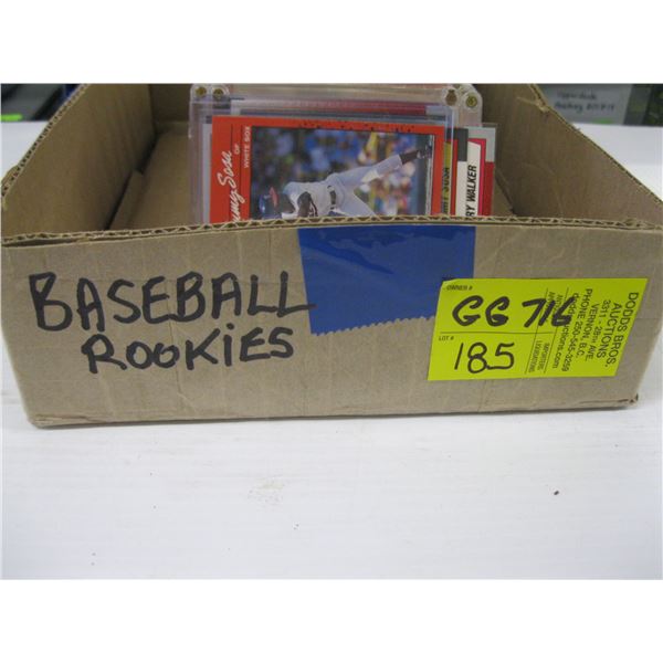 BOX OF BASEBALL ROOKIE CARDS IN PROTECTIVE CASES