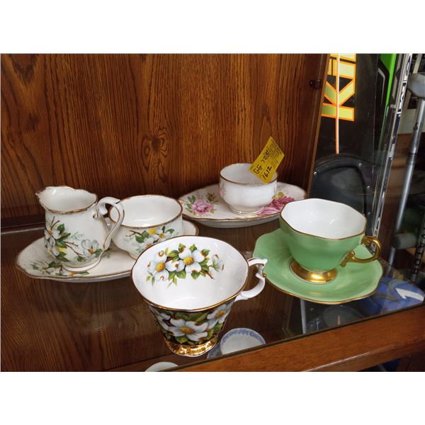 LOT OF CHINA TEA CUPS AND CREAM AND SUGARS