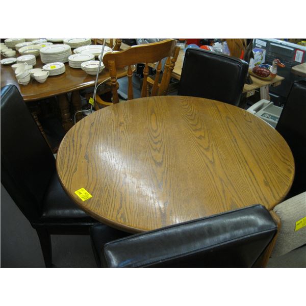 ROUND OAK TABLE WITH 4 BLACK CHAIRS