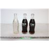 Image 1 : (2) Full Coke Bottles and (1) Empty Bottle