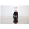 Image 3 : (2) Full Coke Bottles and (1) Empty Bottle