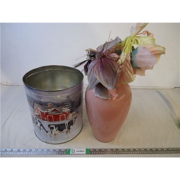 Vase with plastic flowers and large tin