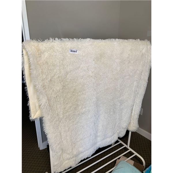 White Soft Blanket and white clothes rack